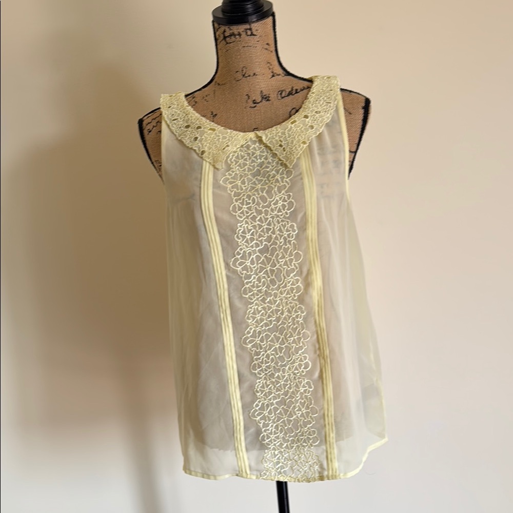 Elegant Yellow Sleeveless Blouse with Lace Detail